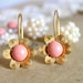 Pink and gold flower earrings - 14k gold plated earrings with real pink swarovski pearls .