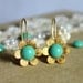 Tiffanys blue gold flower earrings - 14k gold plated earrings with real Turquoise swarovski pearls .