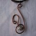 Brown wire pendant.