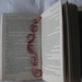 Red curly wire bookmark