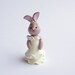 Polymer clay miniature beige bunny rabbit doll in ivory coloured dress for 1/4 scale dollhouse