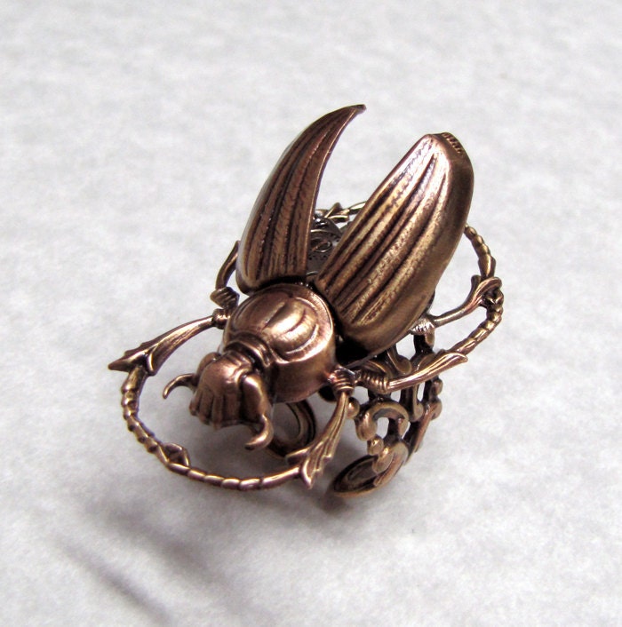 Steampunk Golden Scarab ' with revealed gears '