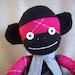 A Sock Monkey in Pink and Black Argyle- Vera