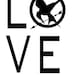 The Hunger Games inspired Mockingjay with quote Love real or not real SM....vinyl lettering...