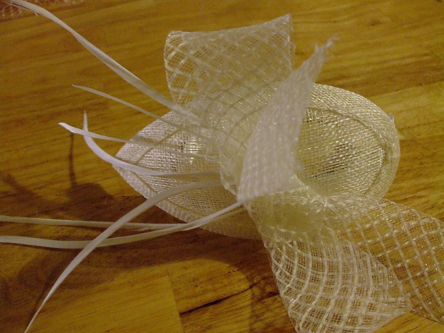 Ivory bow and feather bridal fascinator