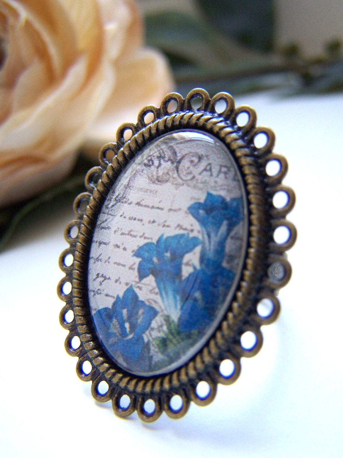 the blue flower and vintage postcard ring.