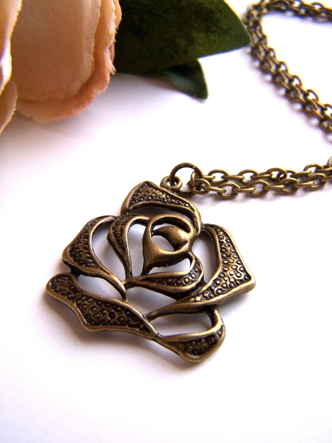 the bronze rose necklace.