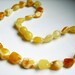 Olive White beads Baltic Amber teething necklace for your baby handmade knotted .High quality amber.