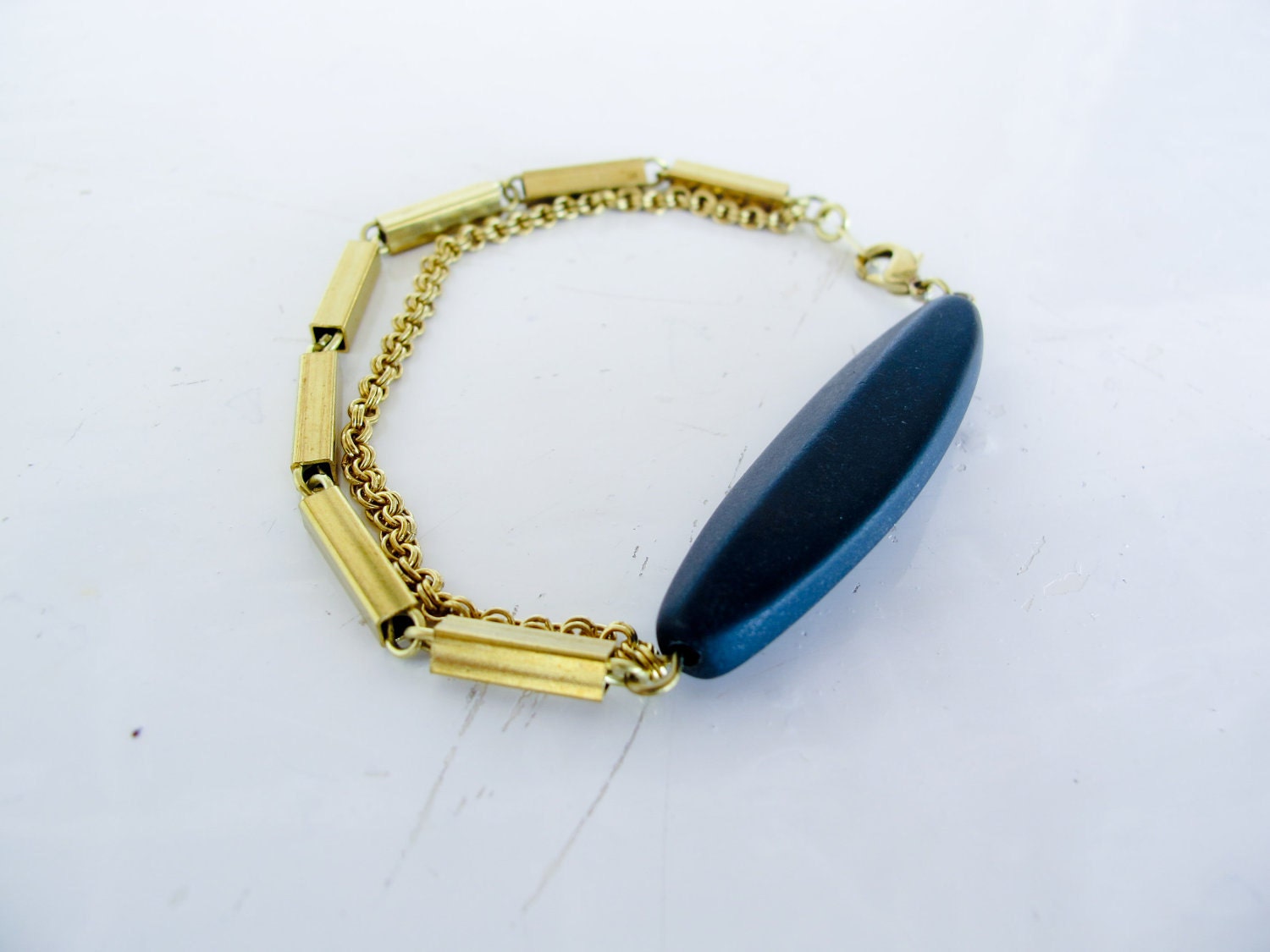 Lilith - geometric black oblong lava stone and vintage brass chain bracelet
