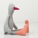 baby bird - gray small duck or penguin with burgundy beak Wearing striped peach socks - handmade fabric doll