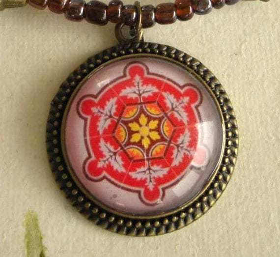 Spanish Tile Design Medallion in Red, Yellow & Pink on a Dark Plum Colored Beaded Necklace