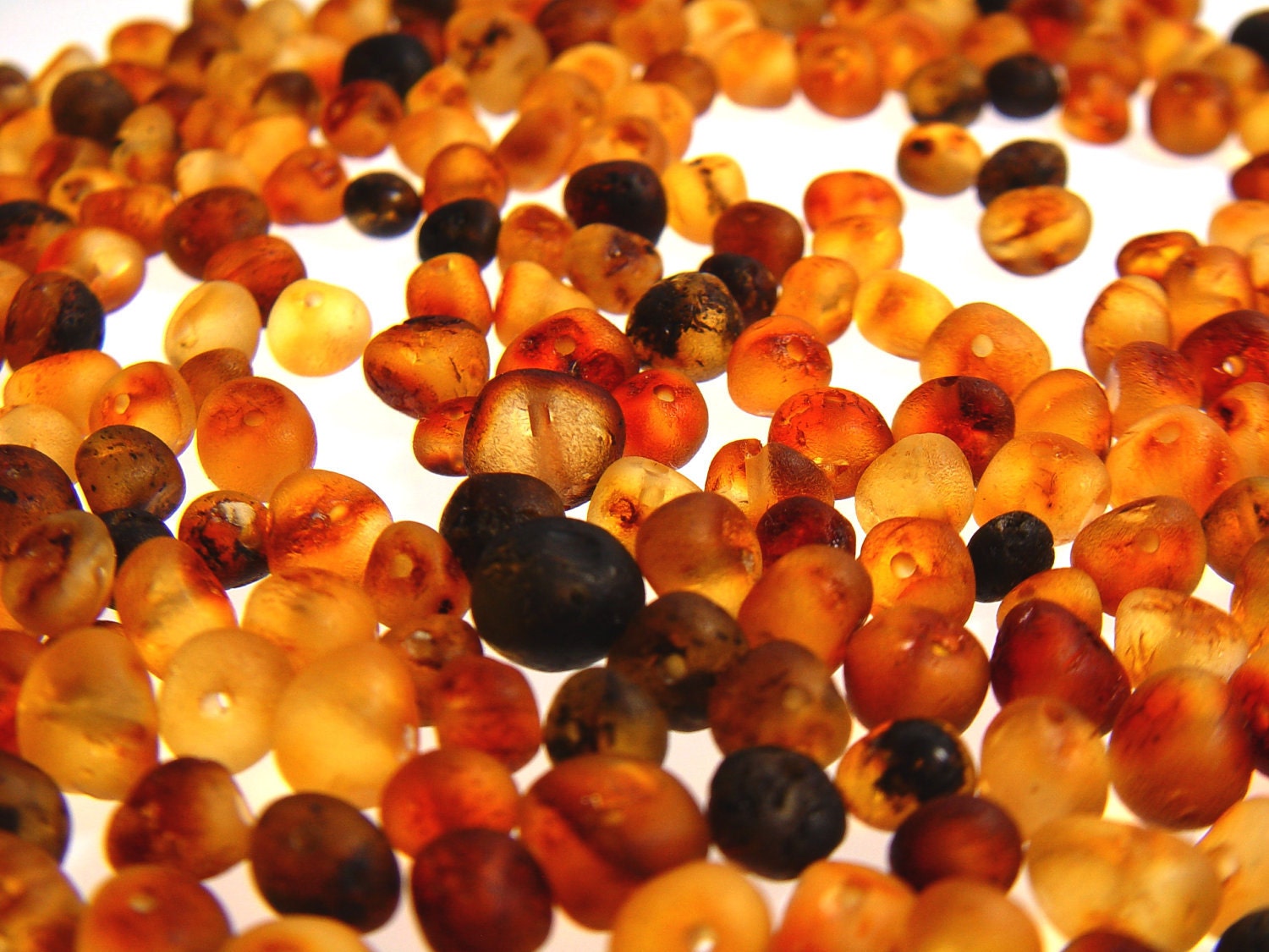 Special offer of 50 pieces baroque shape Baltic amber beads with drilled hole multicolored. BlbRBD151