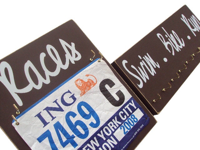 triathlon: swim bike run  Display your triathlon bibs and medals