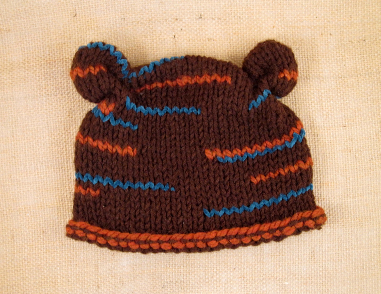 Knit hat with ears in brown and turquoise