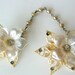 RESERVED. Mid century sweater guard, flowers and faux ivory filigree: pop culture, sock hop, vestiesteam