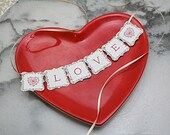Cake banner, mini bunting. LOVE and hearts in crimson red, with vintage dictionary background.