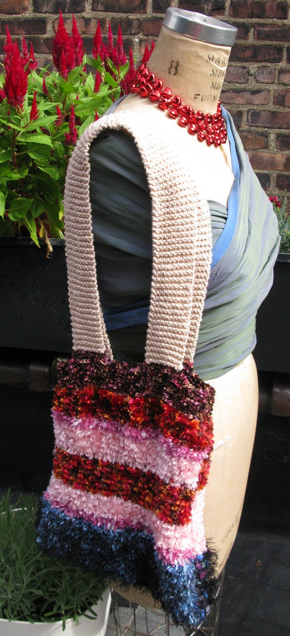 Boho chic: Striped and fluffy shoulder purse.
