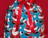 Santa Claus on Blue Medium Fabric Gift Bag - Holiday, Christmas, Snowflakes, Red, Black, White, Teal, Jolly