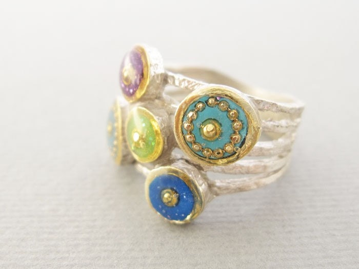 Circles ring in Sterling silver, five bands with circles are in shades of blue, green, turquoise and purple