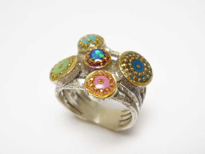 Circles ring in Sterling silver, five bands with circles are in shades of blue, green, turquoise and purple