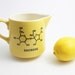Yellow and Black Maple Syrup Pitcher with Sucrose Chemistry Molecule
