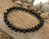 s o o t h i n g - genuine onyx wrist mala bracelet