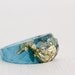 ocean blue gold multifaceted eco resin ring with suspended gold flakes