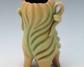 Matte green carved leafy lady vase with brown interior, porcelain