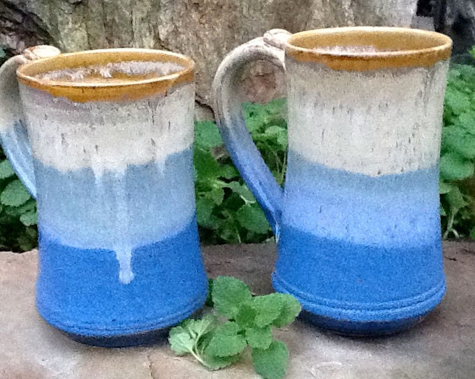A Pair of White and Blue Mugs or Tankards