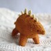 orange stegosaurus - dinosaur plush, felt soft sculpture by royalmint