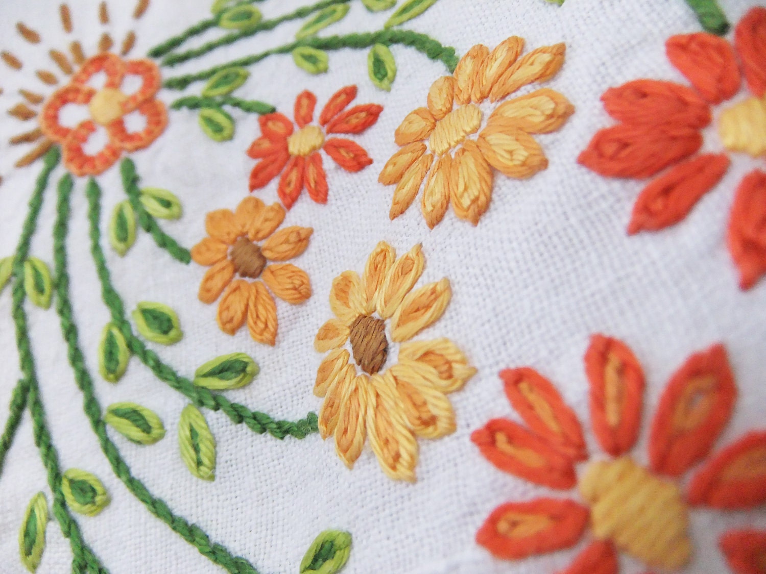 Vintage embroidered tablecloth with orange, peach and apricot flowers