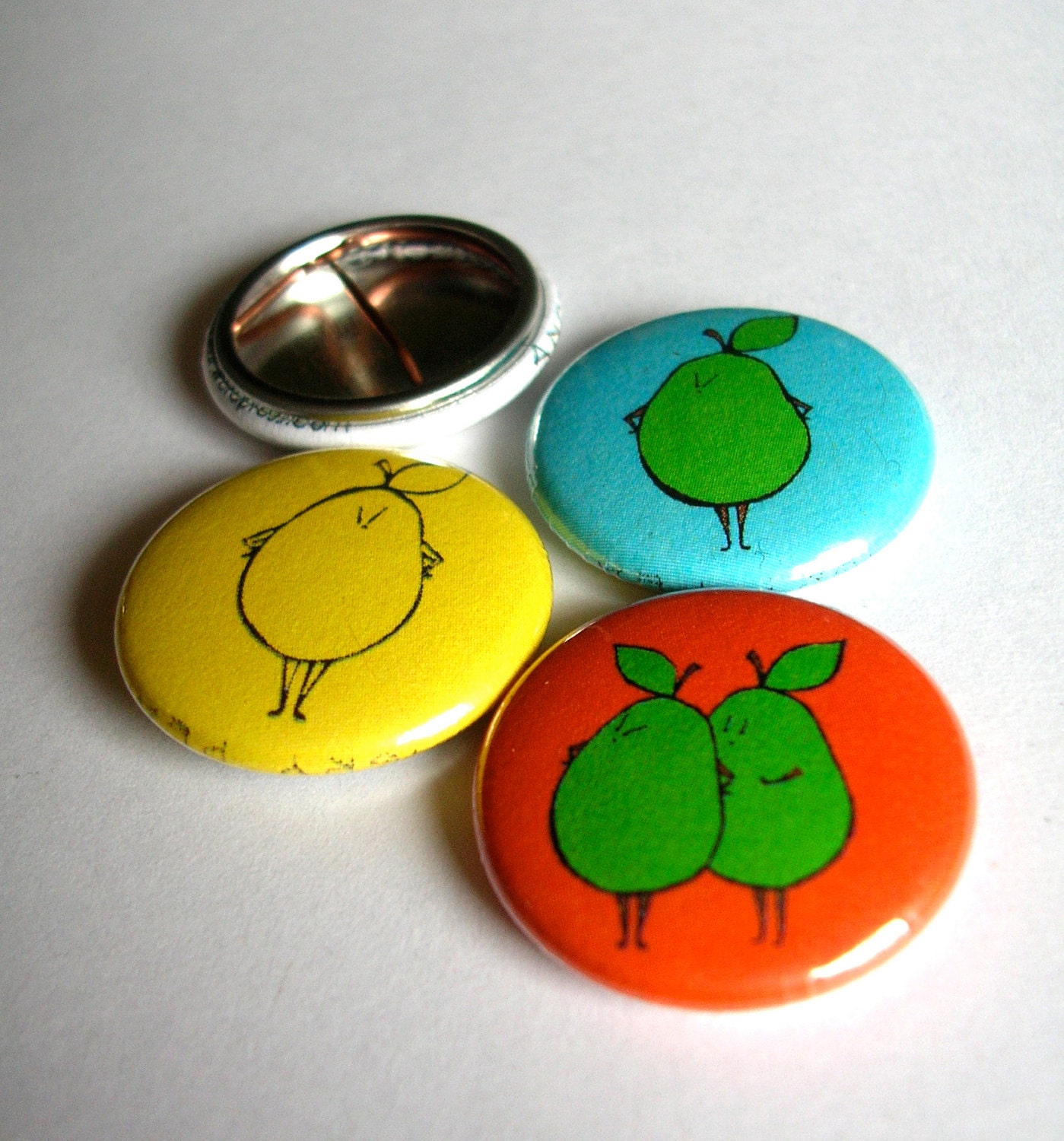 Funny, Angry Pear button set of 4 - color