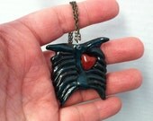 Zombie Love,  Zombie rib cage and heart.   necklace or keychain