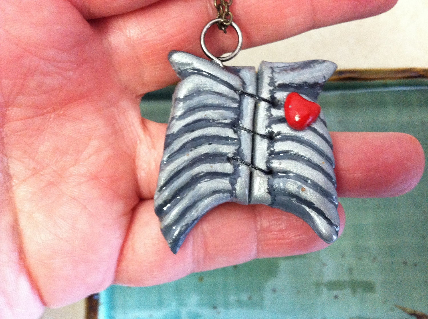 Sale... Love heals all,    Necklace, keychain broken rib cage, sewn together
