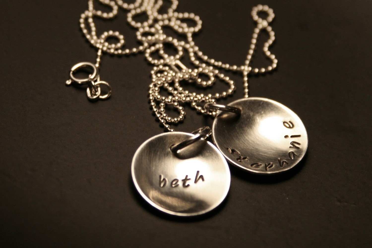 personalized handstamped sterling silver discs with names