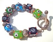 Colorful Whimsical Bracelet, Lampwork  Beads, Sterling Silver, Blue, Green, Blue, Black, Fun and Funky