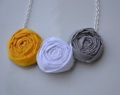 Trio of grey, yellow, and white rosette necklace