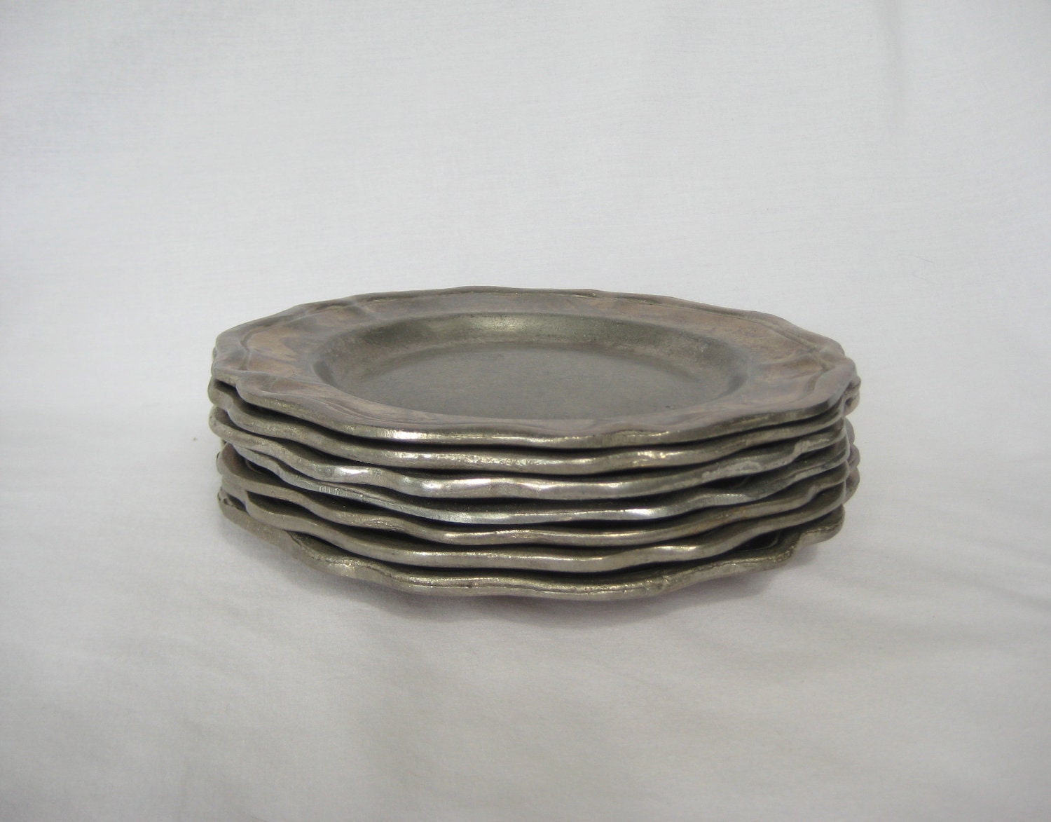 Set of Seven Pewter Plates