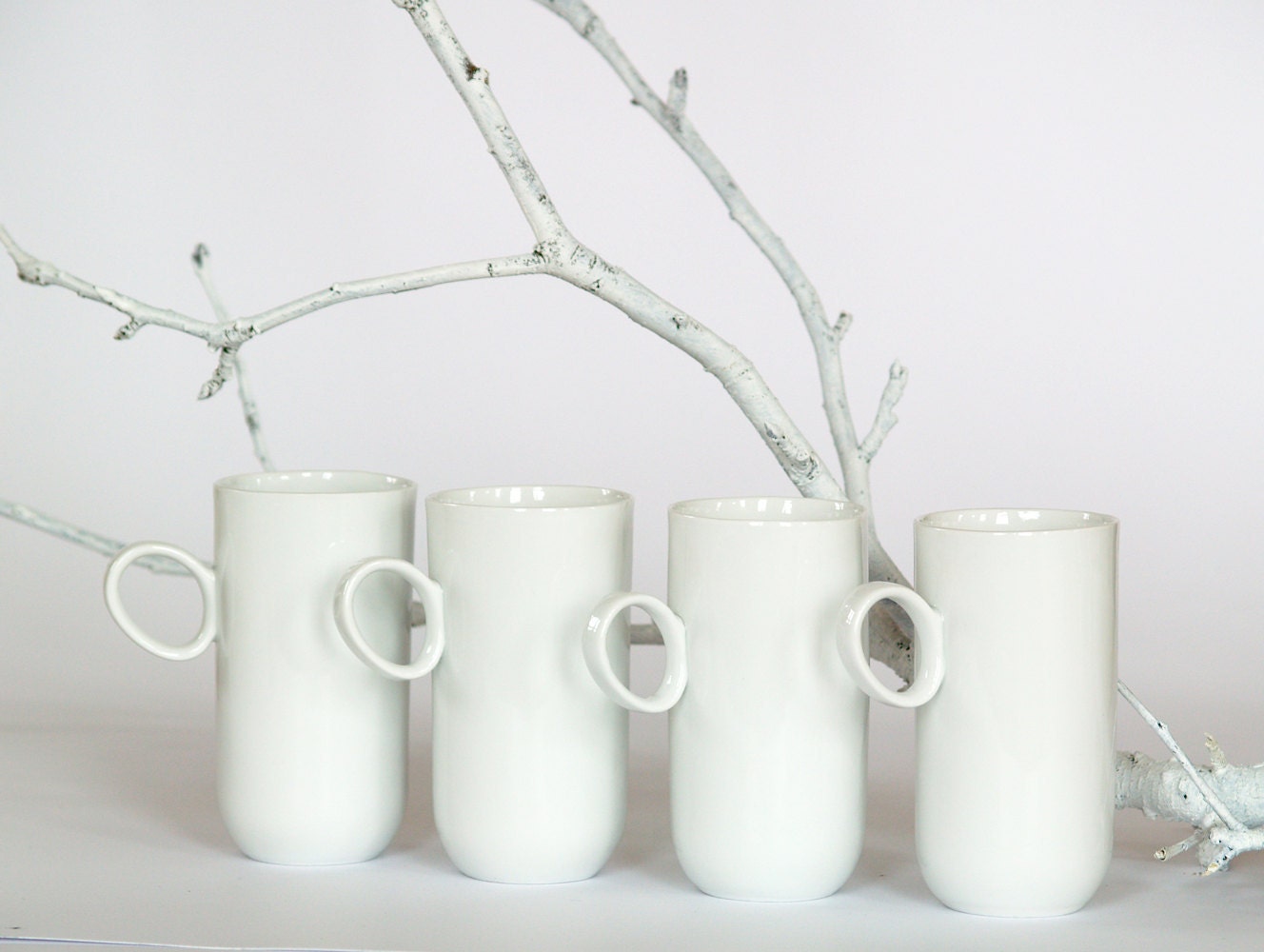 Elegant porcelain cups set - four modern white ceramic coffee or tea cups by Endesign.