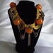 Vintage beaded necklace, orange glass, silver detailed charms and chain on vintage gold ribbon