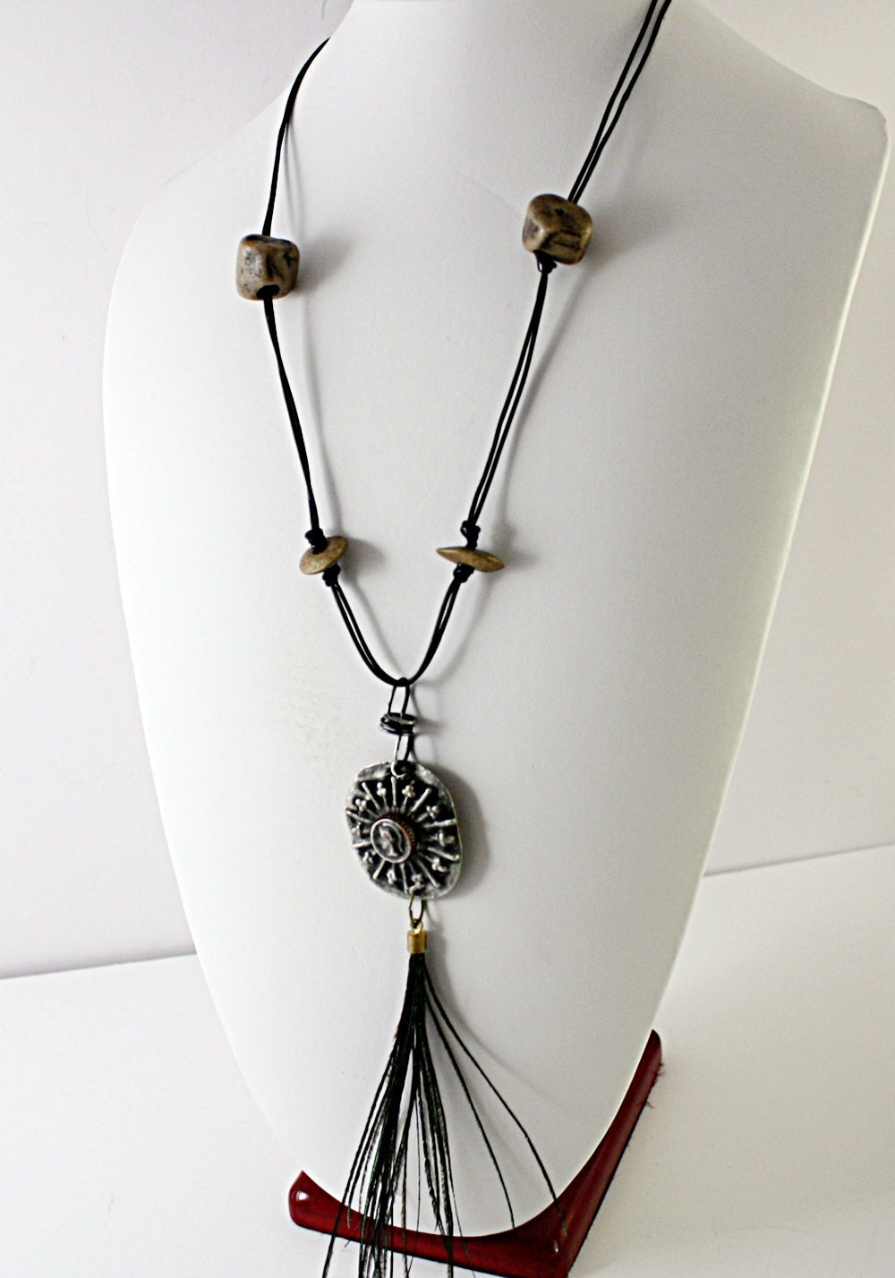 Vintage  Necklace Assemblage  with gladiator type medallion figure, Tribal Beads,  Feathers, and Vintage Glass Button Closure
