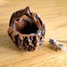 Vintage hand carved Fruit Pit into tiny Basket
