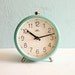 Vintage turquoise mechanical alarm clock working