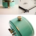 Vintage turquoise mechanical alarm clock working