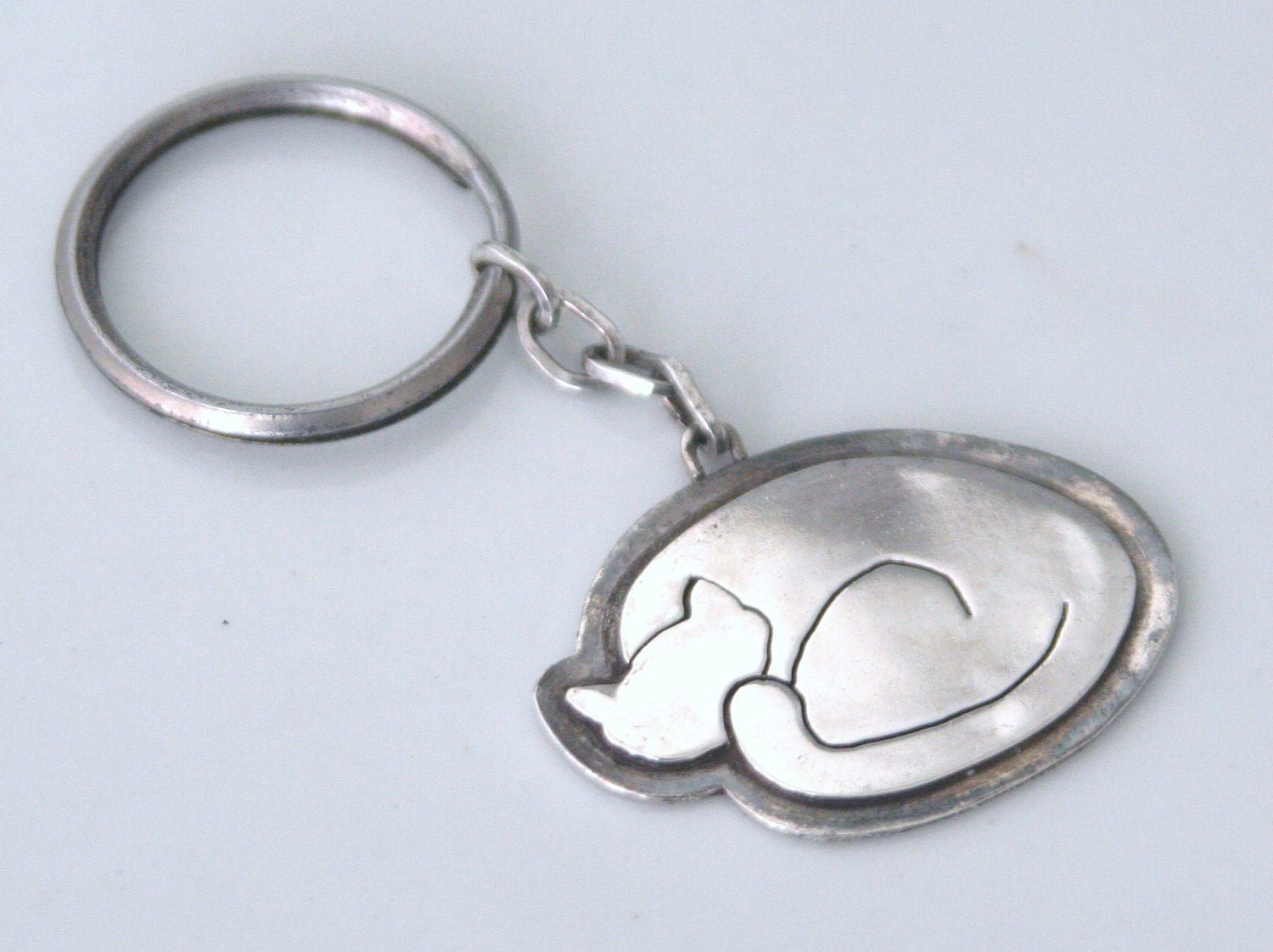 Sleeping kitty sterling silver keychain or pendant