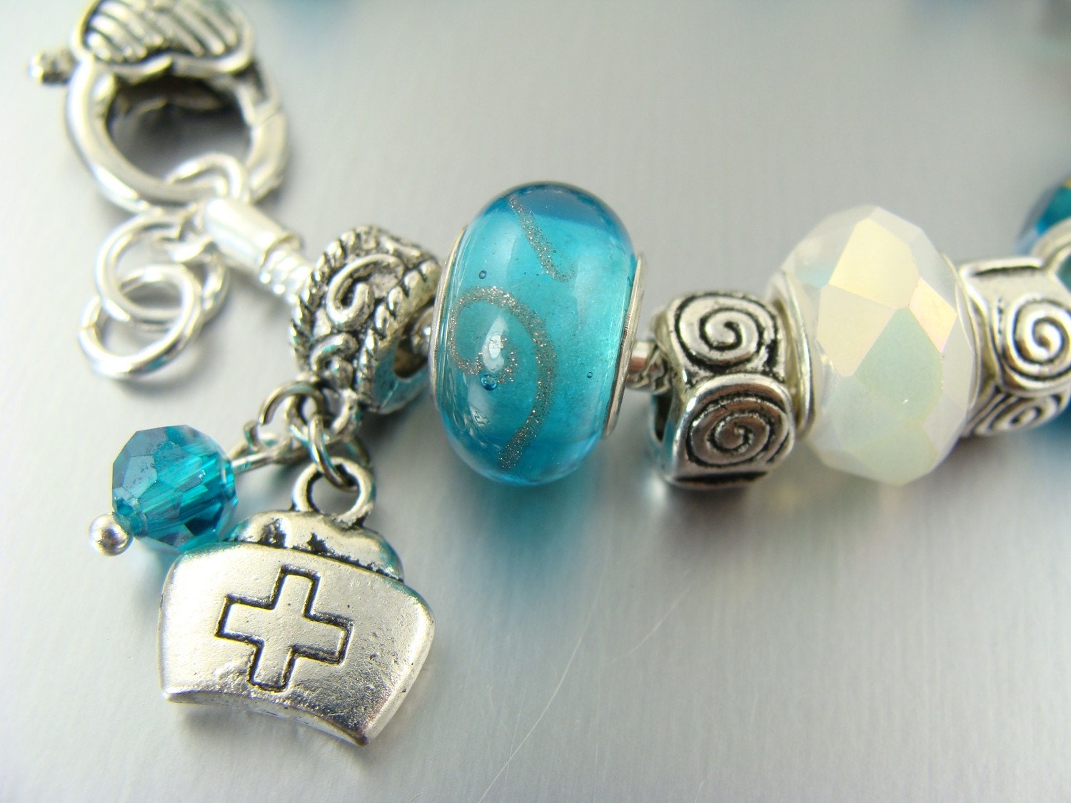 nurse in blue pandora like charm bead bracelets by elorra123