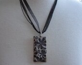 Porcelain Pendant of floral impressions  in mauve