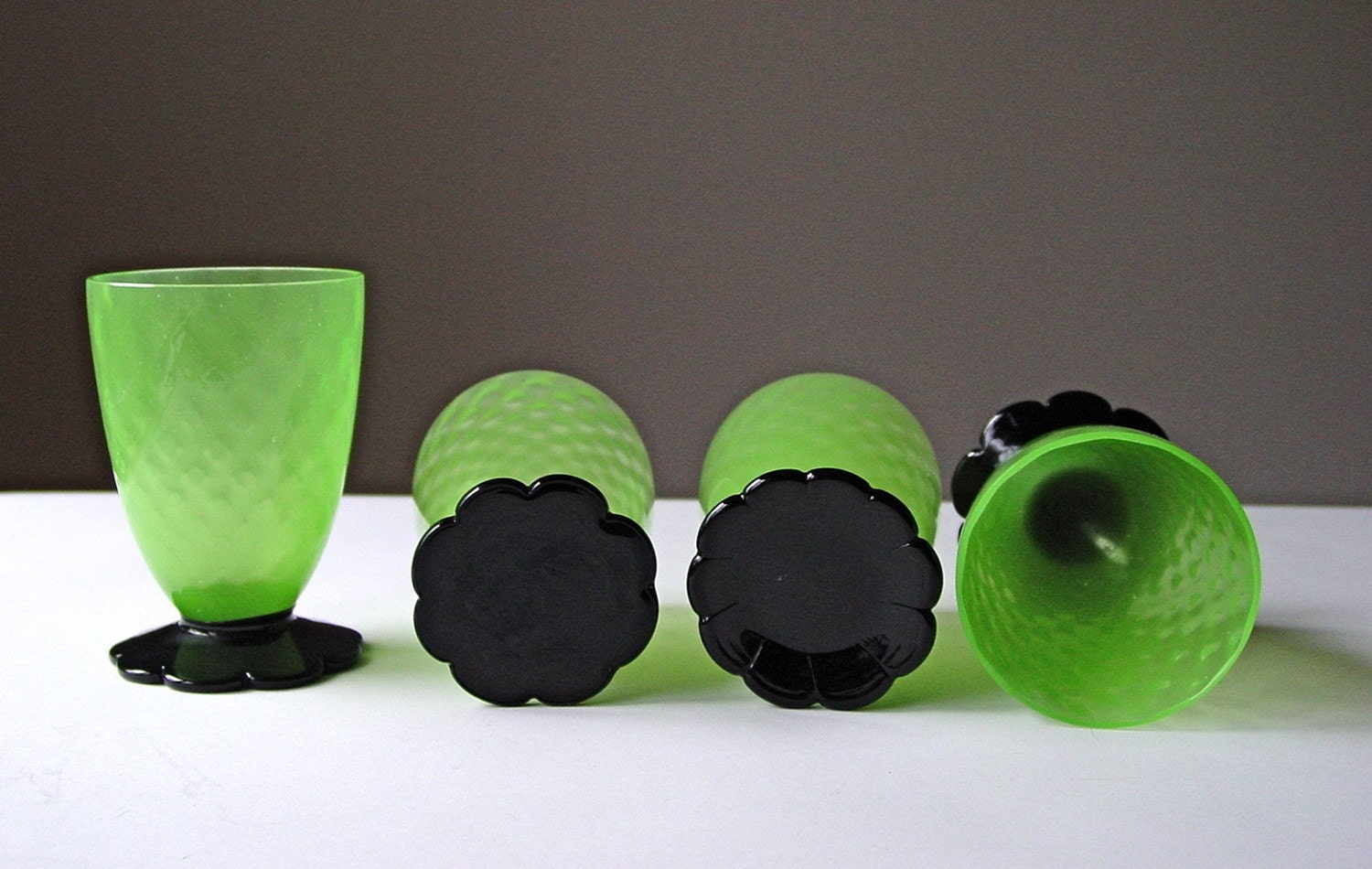 SALE...Grey Gardens Juice Glasses Absinthe Green Depression Glass Black Flower Feet Vaseline