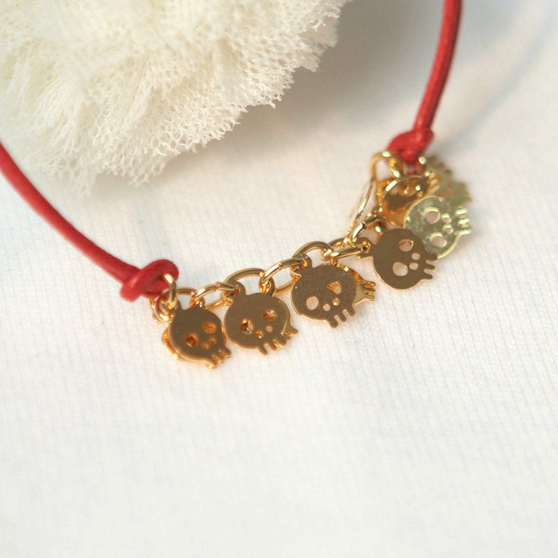 Baby Skull Bracelet -gold plated brass in red cord