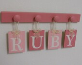 Custom Personalized Monogrammed Boutique Baby Name Wall Hanging for RUBY with 4 Wooden Pegs Pink